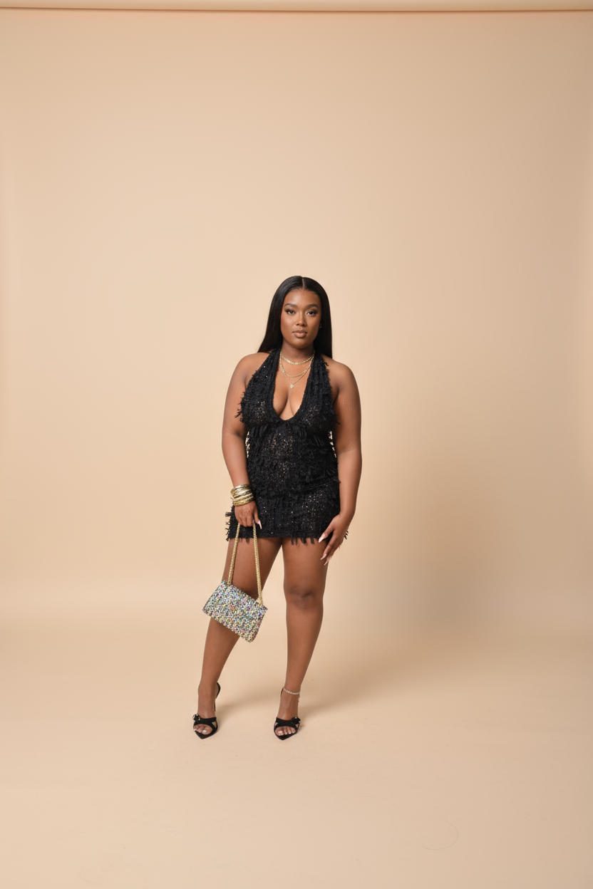 Black lace halter mini dress with plunging neckline. Ties around the and drapes along the back. Perfect for night out, special occasion, or wedding 